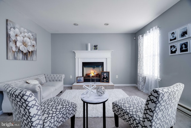 living room featuring light carpet and baseboard heating