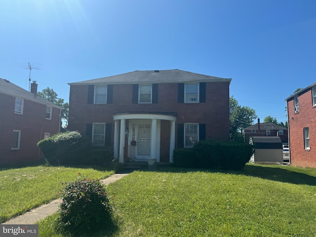 view of front of property with a front lawn