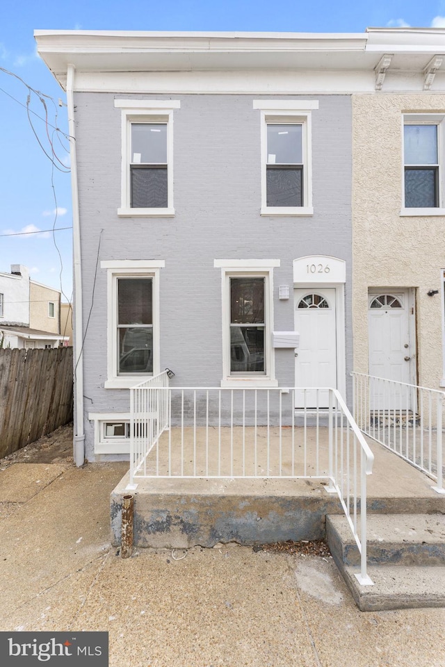 multi unit property with fence and brick siding