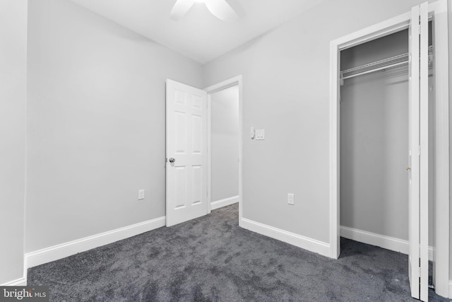 unfurnished bedroom with a ceiling fan, carpet, a closet, and baseboards