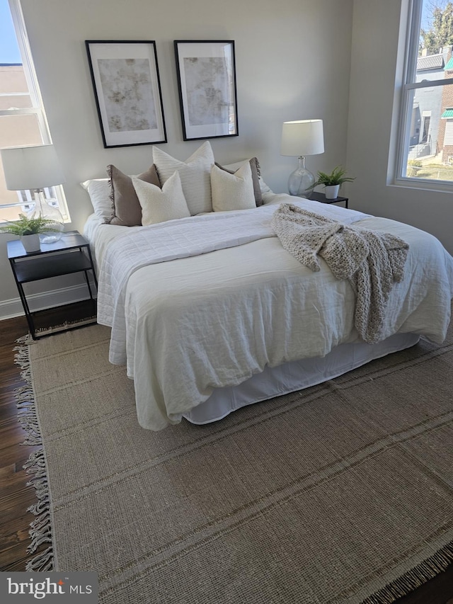 bedroom featuring wood finished floors