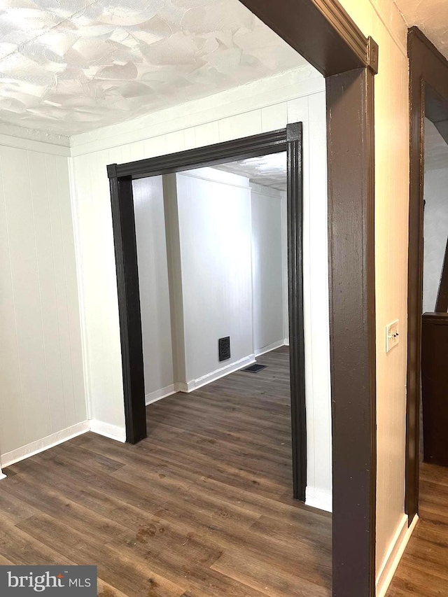 hall with dark hardwood / wood-style floors