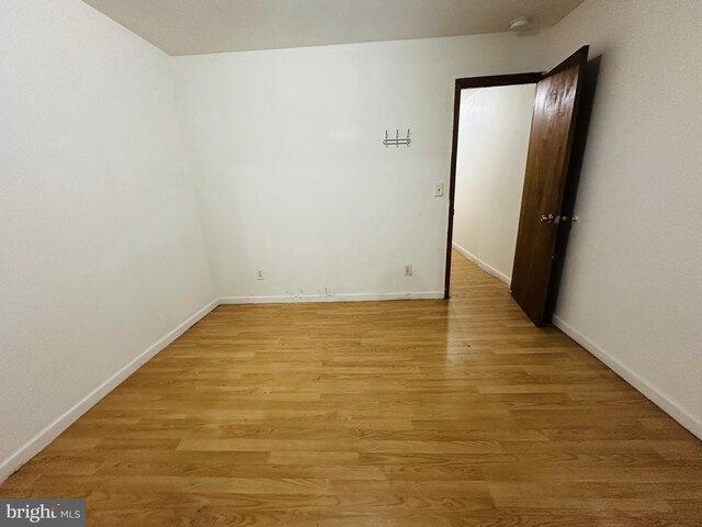 2018 S 7th St, Philadelphia, PA 19148 - empty room with light wood-type flooring and baseboards