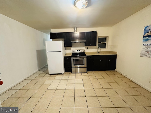 2018 S 7th St, Philadelphia, PA 19148 - kitchen featuring stainless steel electric range oven, freestanding refrigerator, under cabinet range hood, dark cabinets, and light countertops