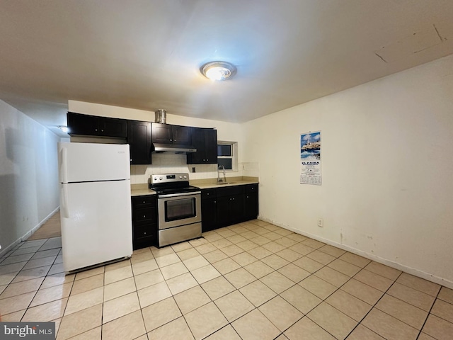 2018 S 7th St, Philadelphia, PA 19148 - kitchen featuring freestanding refrigerator, electric range, dark cabinetry, and under cabinet range hood