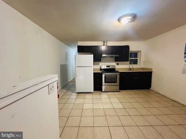 2018 S 7th St, Philadelphia, PA 19148 - kitchen with stainless steel range with electric stovetop, freestanding refrigerator, dark cabinets, and light countertops
