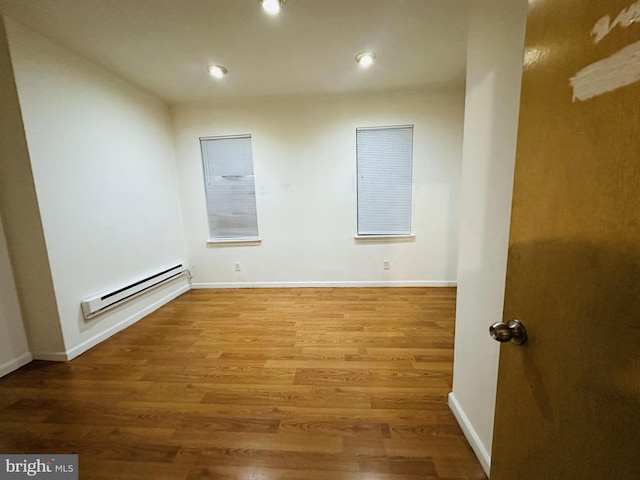 2018 S 7th St, Philadelphia, PA 19148 - empty room with a baseboard radiator, wood finished floors, recessed lighting, and baseboards
