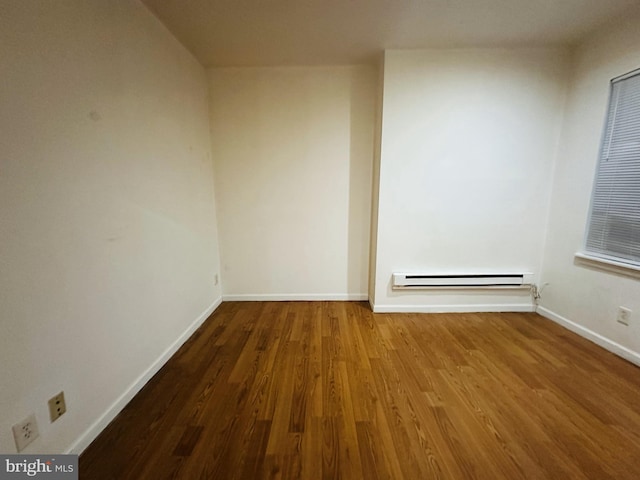 2018 S 7th St, Philadelphia, PA 19148 - spare room featuring wood finished floors, baseboards, and baseboard heating