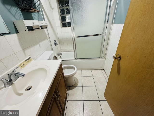 2018 S 7th St, Philadelphia, PA 19148 - full bathroom featuring tile walls, toilet, vanity, tile patterned floors, and combined bath / shower with glass door