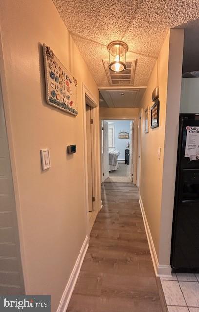 hallway featuring wood-type flooring