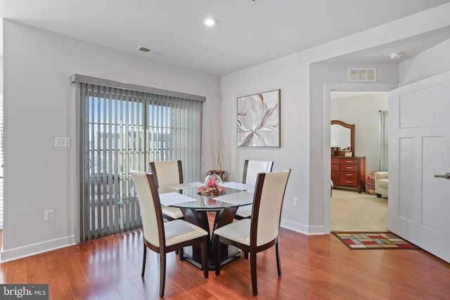 dining area featuring hardwood / wood-style floors