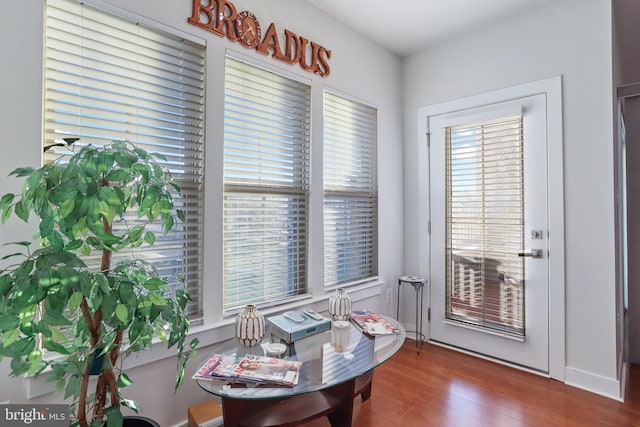 dining space with dark wood-type flooring