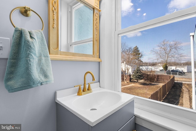 bathroom with vanity and a wealth of natural light