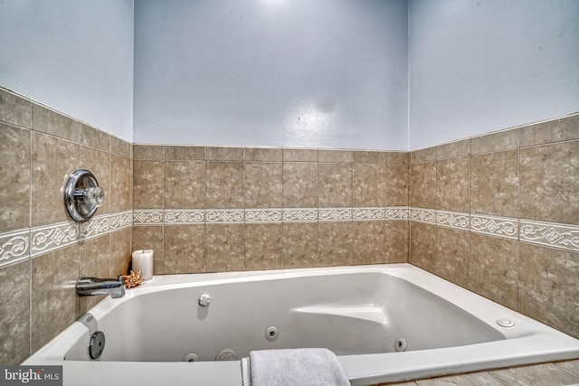 bathroom with tiled bath