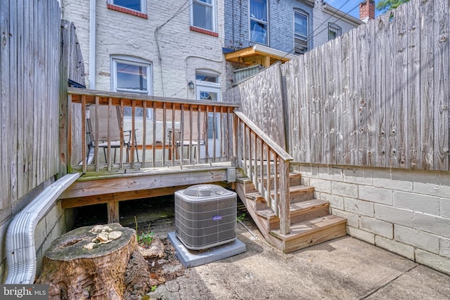 wooden deck with central air condition unit