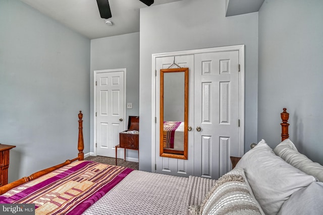 carpeted bedroom featuring a closet and ceiling fan