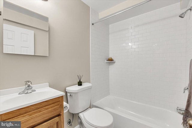 full bathroom with vanity, toilet, and tiled shower / bath combo