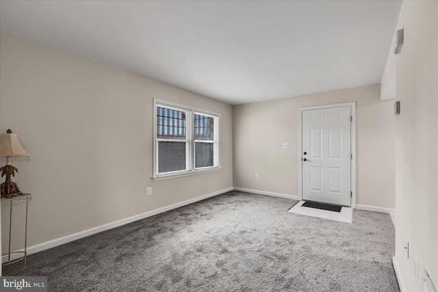 entrance foyer featuring carpet