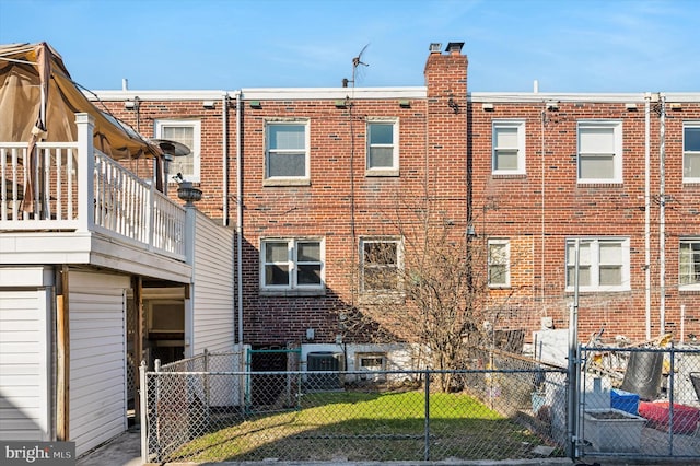 rear view of property featuring central AC unit