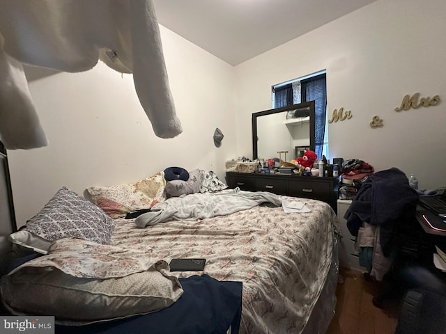 bedroom with hardwood / wood-style flooring