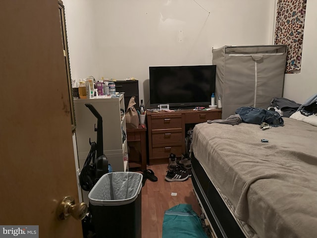 bedroom featuring wood-type flooring