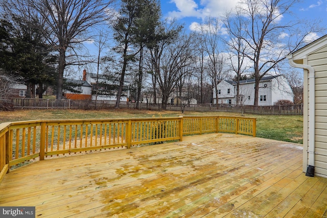 wooden deck with a lawn