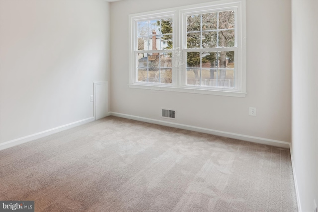 empty room featuring carpet floors