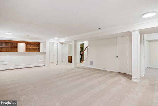 basement featuring light colored carpet