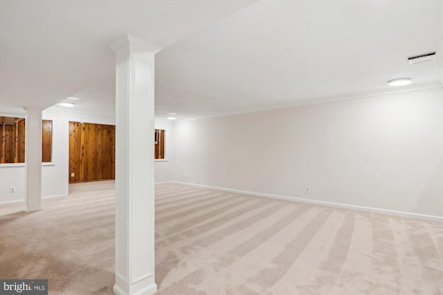 basement featuring light carpet and crown molding