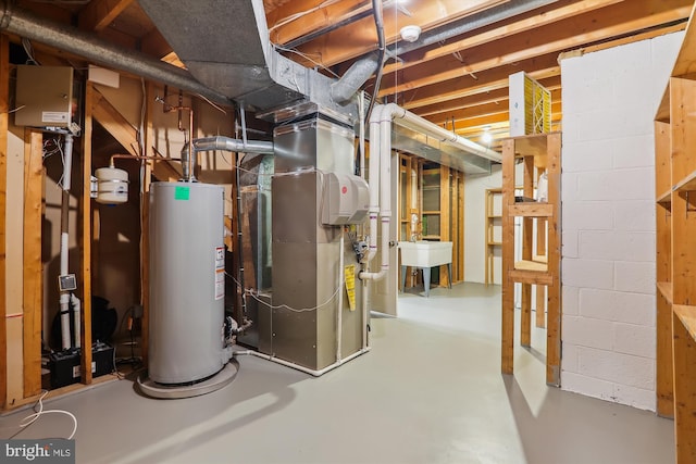 utility room featuring heating unit, sink, and gas water heater