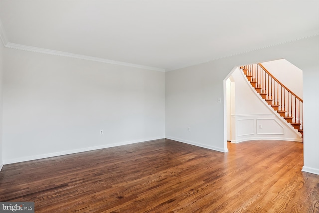 unfurnished room featuring hardwood / wood-style flooring and ornamental molding