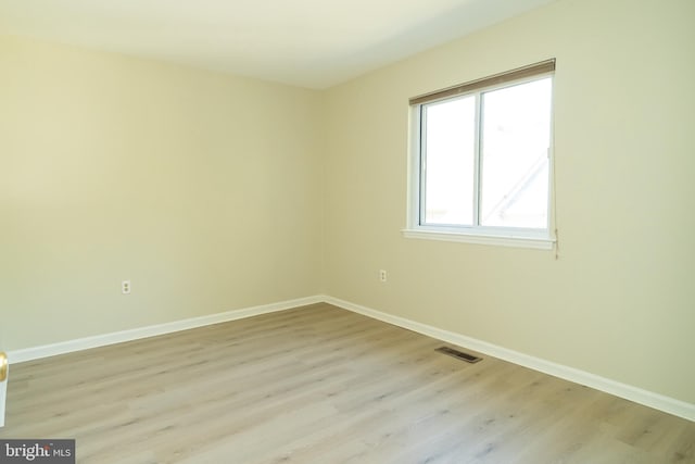 spare room featuring light wood-type flooring