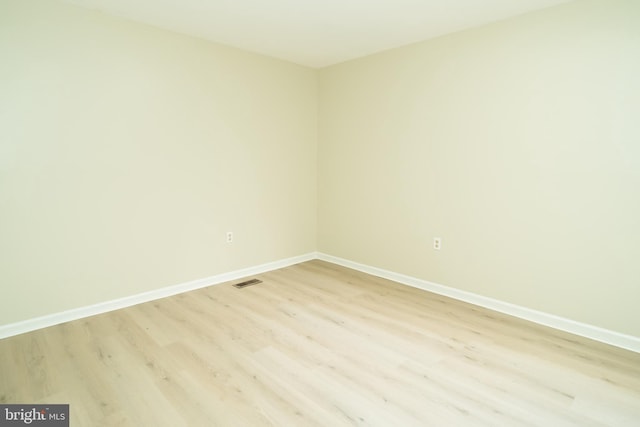 unfurnished room featuring light hardwood / wood-style flooring