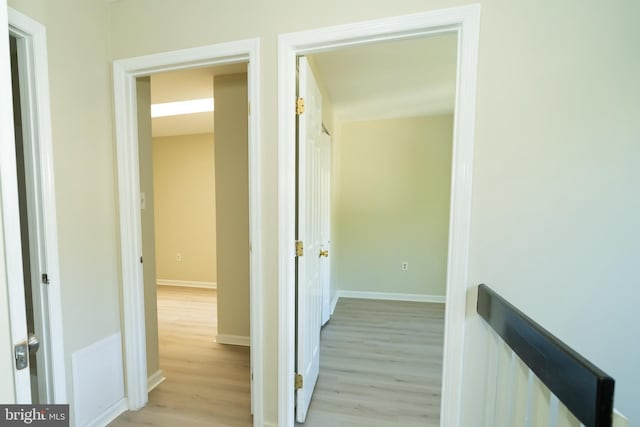 hall with light hardwood / wood-style floors