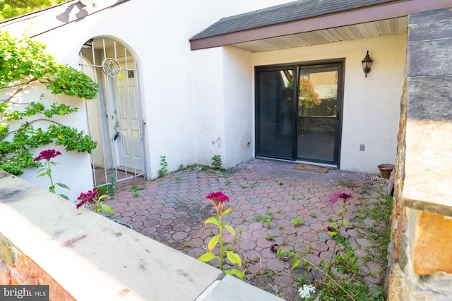 property entrance with a patio area