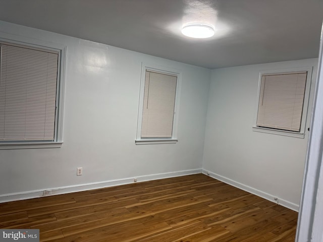 empty room featuring dark hardwood / wood-style floors