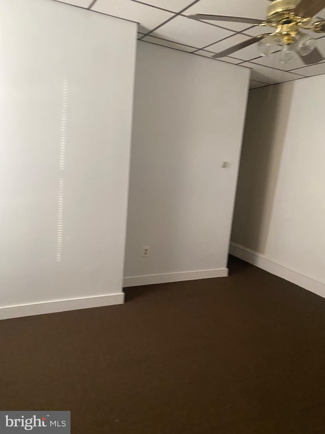 unfurnished room featuring ceiling fan and a paneled ceiling