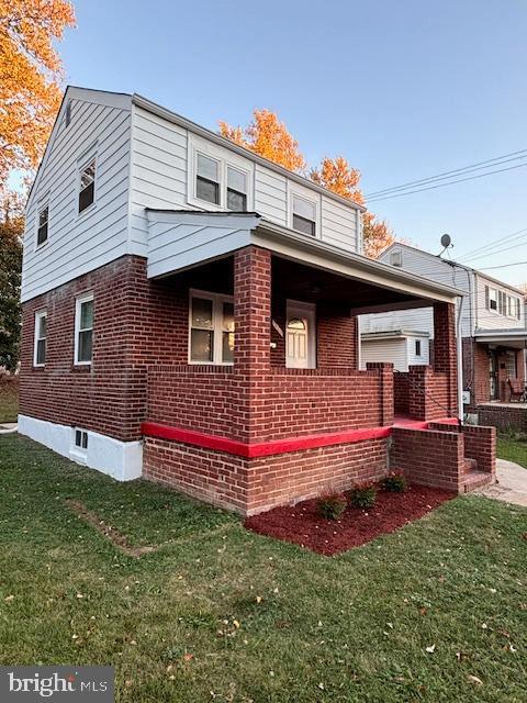 view of home's exterior with a yard