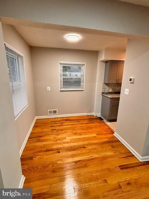 unfurnished dining area with light hardwood / wood-style floors