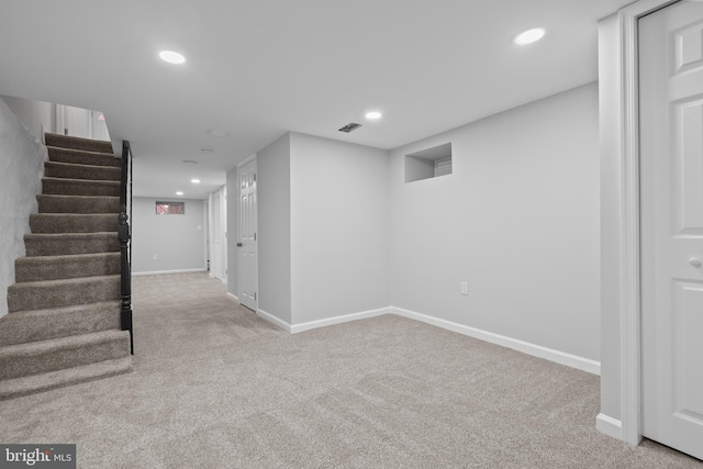 basement with light colored carpet