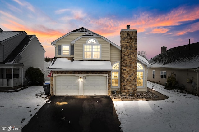 front facade with a garage