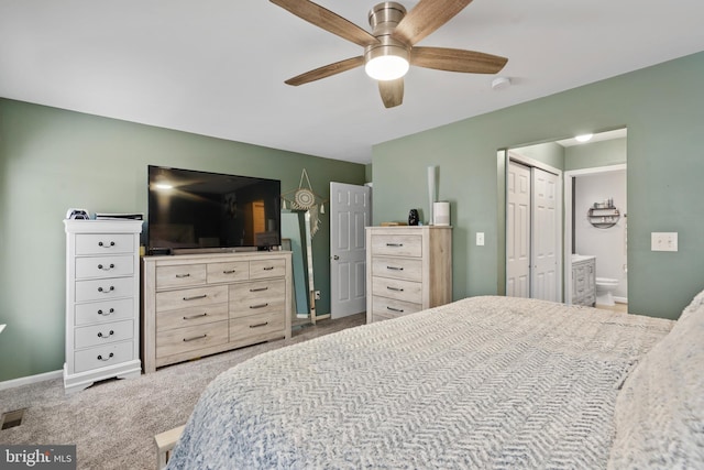 bedroom featuring ceiling fan, connected bathroom, carpet flooring, and a closet