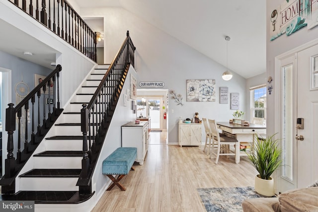 interior space featuring hardwood / wood-style flooring and a high ceiling