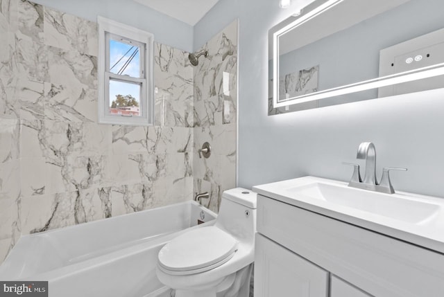 full bathroom with vanity, toilet, and tiled shower / bath combo