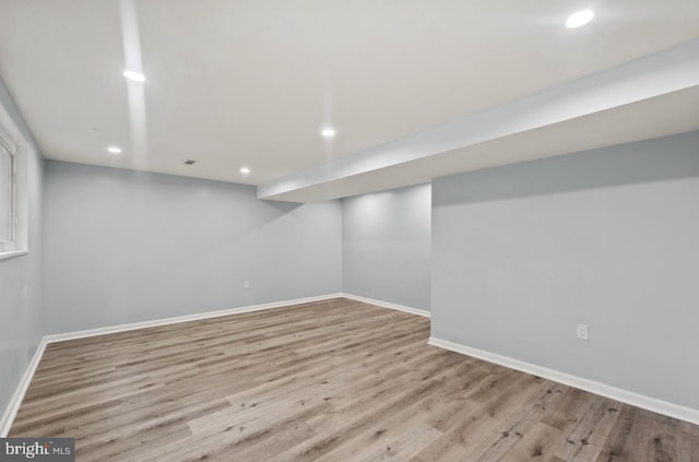 basement featuring light hardwood / wood-style flooring