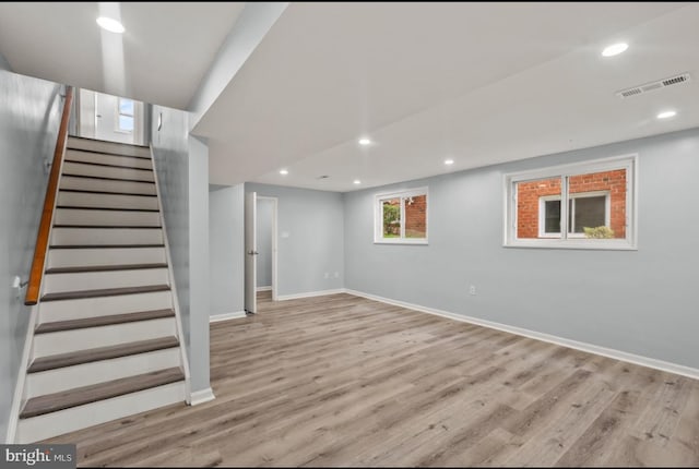 basement featuring light hardwood / wood-style floors