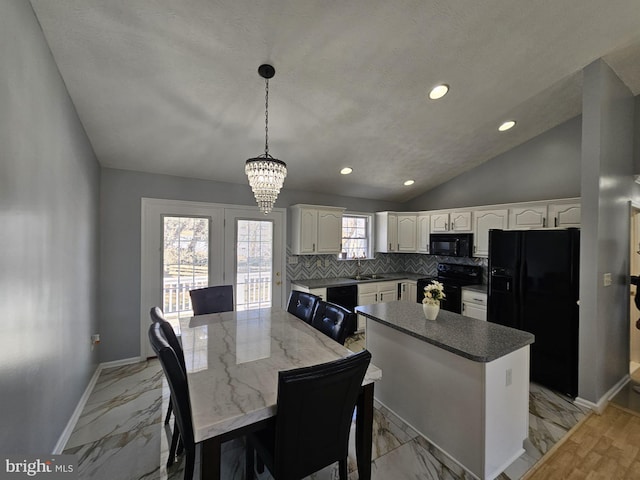 dining room featuring lofted ceiling, marble finish floor, recessed lighting, and baseboards