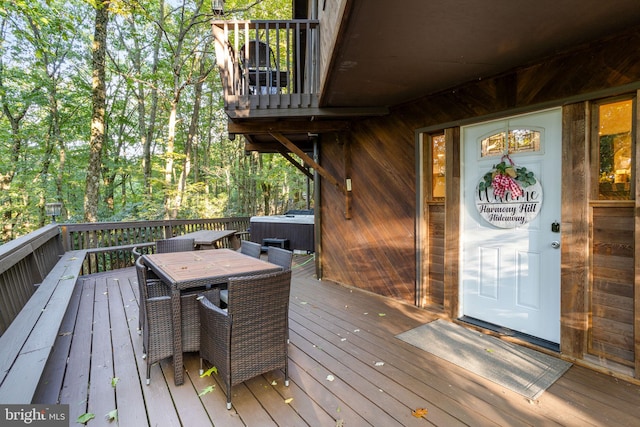 wooden terrace featuring a hot tub