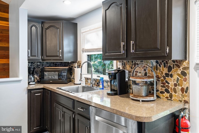 kitchen with tasteful backsplash, dishwasher, sink, and dark brown cabinets