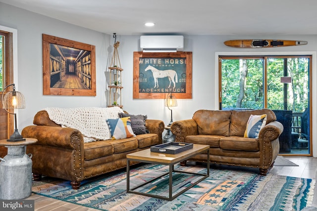 living room featuring hardwood / wood-style floors and a wall mounted AC